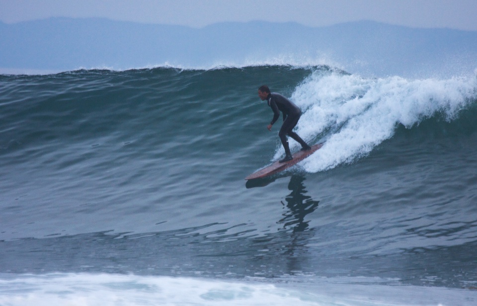 Kevin on his redwood board at Devereux Point