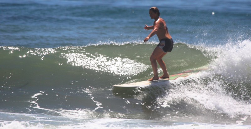 Woman Longboarder at Sands